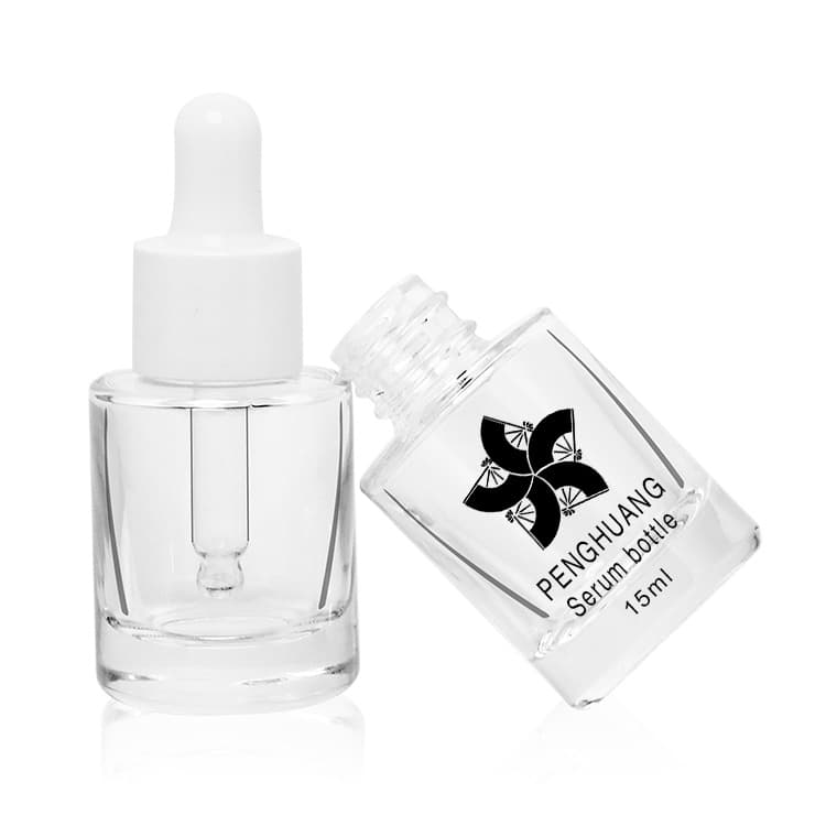 Cosmetic packaging — Custom wholesale round skin care eye drop essence packaging clear 15ml glass dropper bottle cosmetic glass serum bottle