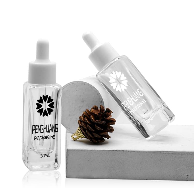 Cosmetic packaging — Face Serum Bottle 30ml Wholesale Skin Care Transparent Square Cosmetic Glass Dropper Bottle Luxury
