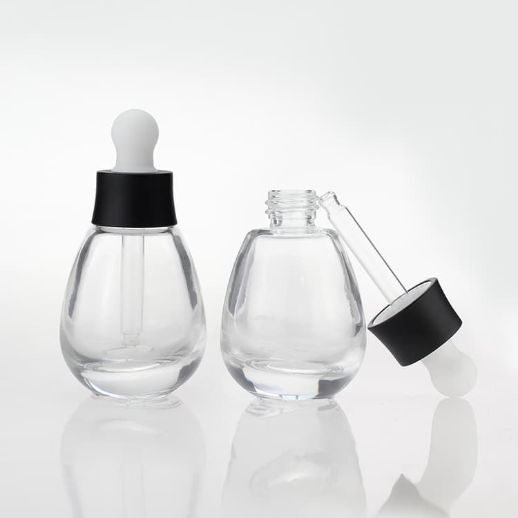 Cosmetic packaging — Fancy Serum Essentila Oil Bottle 30ml Empty cosmetic glass bottle with black collar dropper wholesale price
