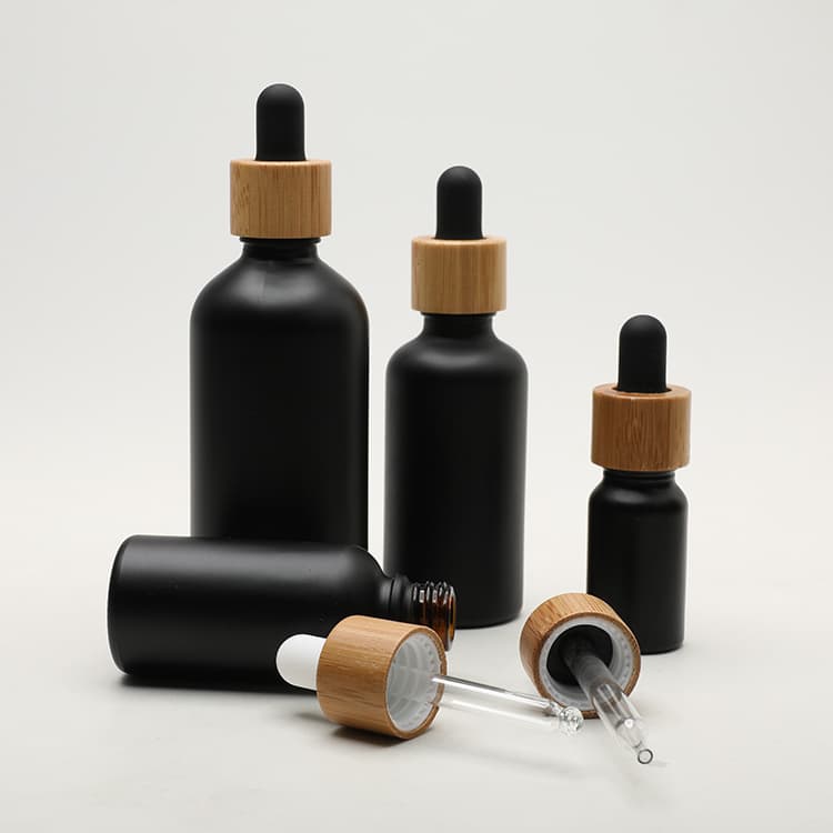 Cosmetic packaging — Matte Black Empty oil glass bottle  30ml with Bamboo Lid Essential Oil Dispenser Glass Dropper Bottles with Pipette