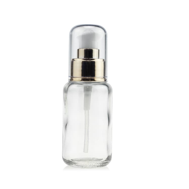 Cosmetic packaging — 30ml 55ml clear round lotion foundation glass pump bottle with golden collar