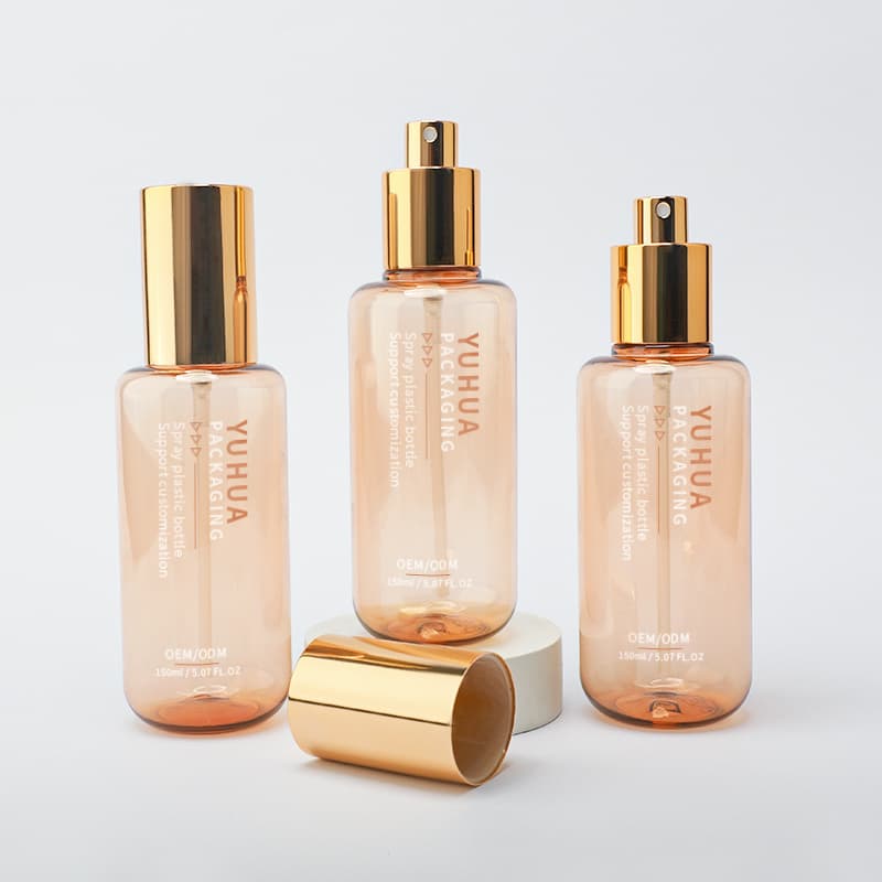 Cosmetic packaging — PET Cosmetic Packaging Container 150ml Transparent Amber Plastic Cosmetic Spray Bottle Gold Cap Round Pump Bottle