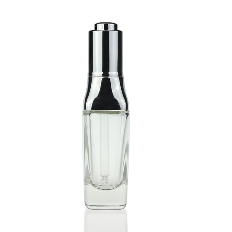 Cosmetic packaging — Manufacturer Direct Supply Shape Silver dropper cap Glass 30ml Clear Empty Glass Serum Bottle