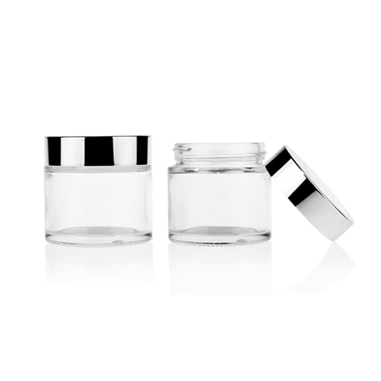 Cosmetic packaging — In Stock Round Shape Skincare Packaging Clear Transparent Cosmetic Empty Glass Facial Cream Jar with Silver Screw Lid