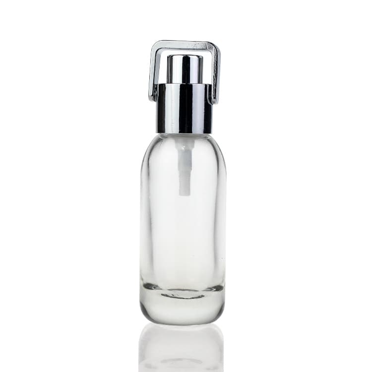 Cosmetic packaging — 30ml Push Button Round clear Face Serum Cosmetic Glass Bottle
