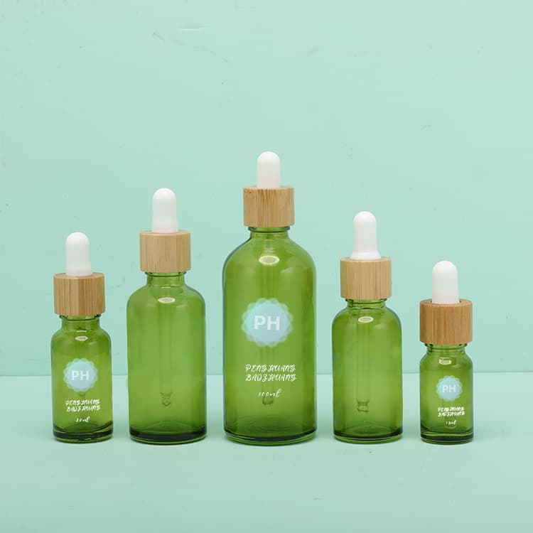 Cosmetic packaging — OEM empty green glass bamboo dropper bottle pipettes cosmetic packaging 15ml 20ml 30ml 50ml 100ml essential oil bottle