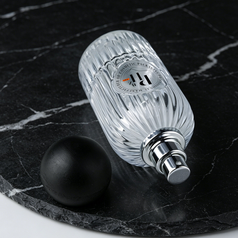 Cosmetic packaging — Custom Ribbed Glass Perfume Bottle 50ml 100ml Clear Refillable Spray Container with Matte Round Ball Lid Press Spray Head (4)